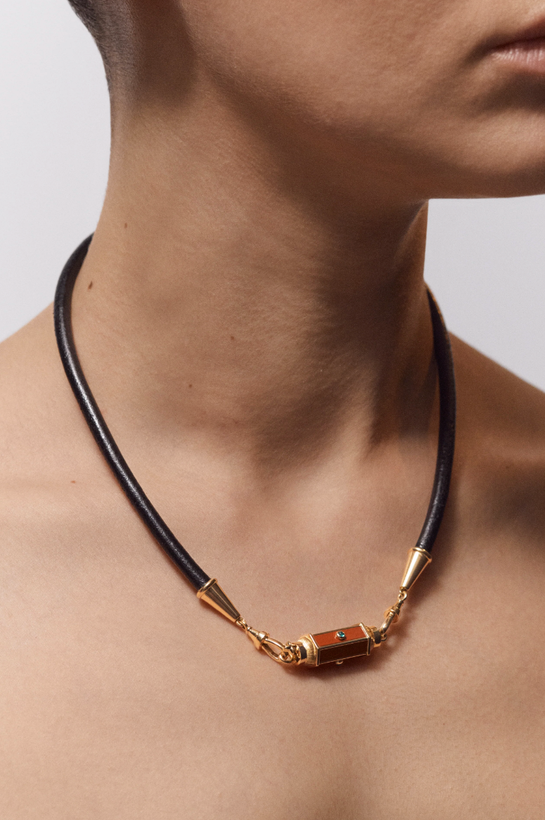 person wearing marie lichtenberg fine jewelry 18k yellow gold Leather Lasso Necklace locket