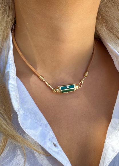 person wearing marie lichtenberg fine jewelry 18k yellow gold diamond Malachite Baby Locket leather lasso necklace