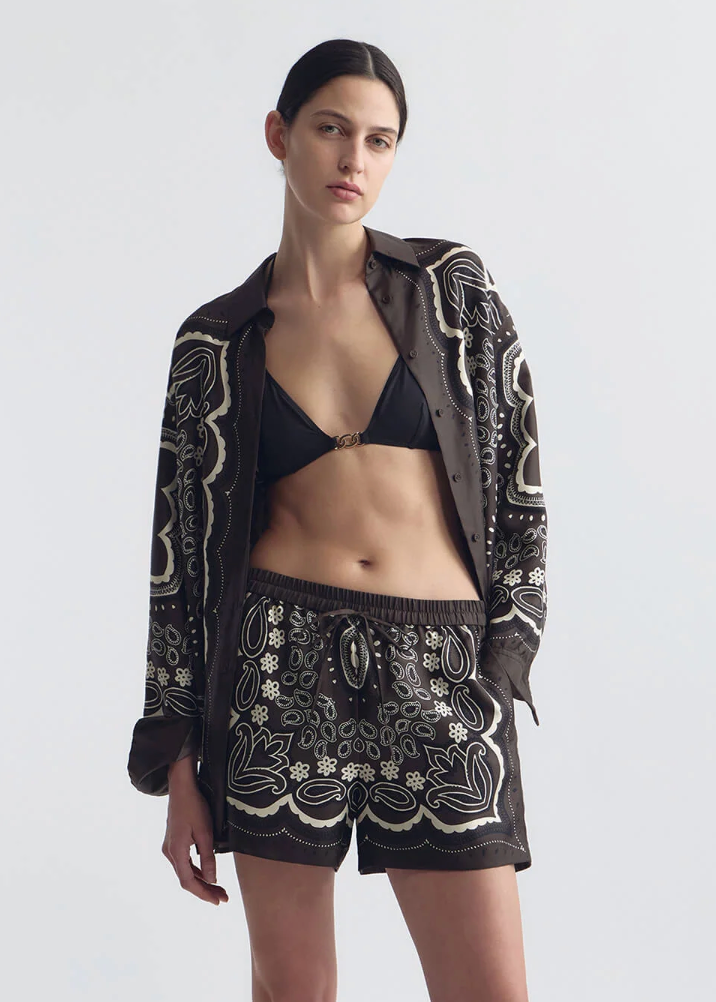 person wearing nili lotan womens Alfie Silk Shirt FRANCES SILK SHORT in Brown ivory bandana print