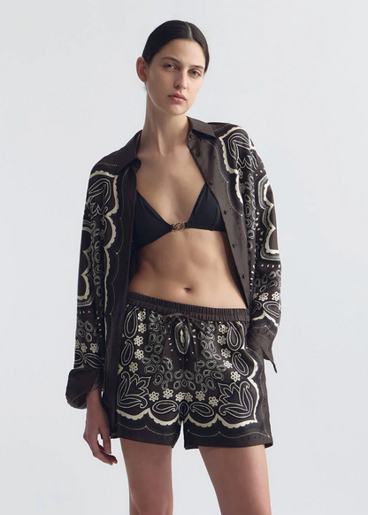 person wearing nili lotan womens Alfie Silk Shirt FRANCES SILK SHORT in Brown ivory bandana print