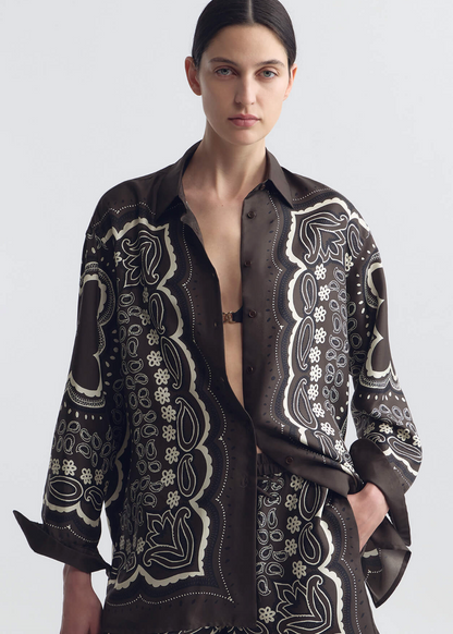 person wearing nili lotan womens Alfie Silk Shirt in Brown ivory bandana print