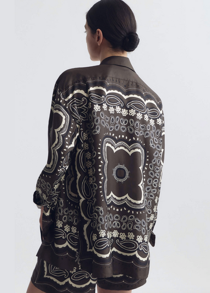 person wearing nili lotan womens Alfie Silk Shirt in Brown ivory bandana print