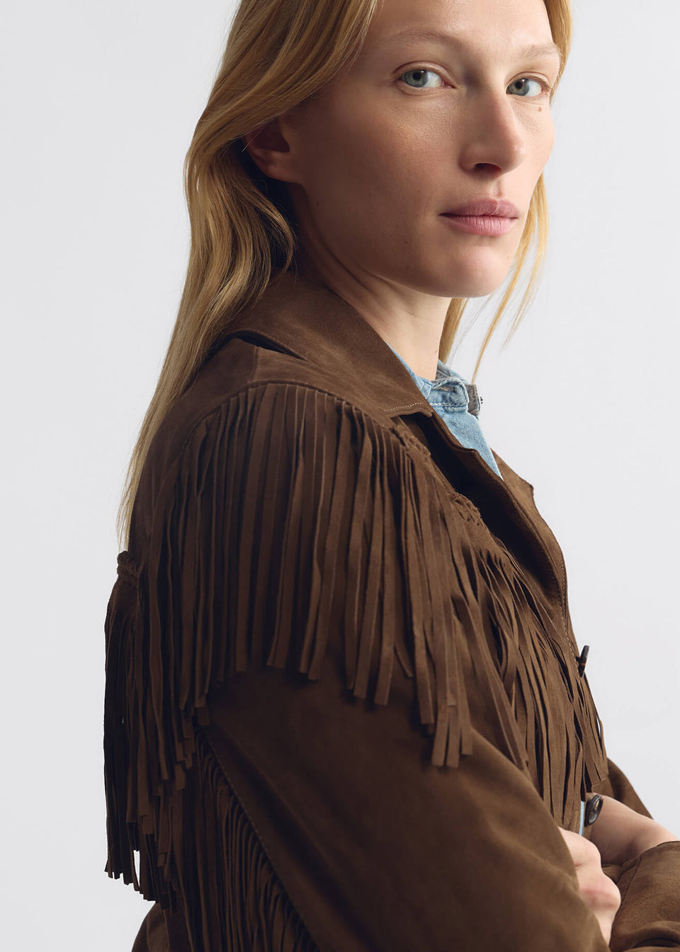 person wearing nili lotan womens Eloi Suede fringe Jacket in Hazelnut brown
