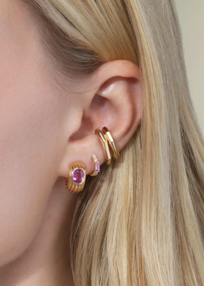 person wearing one of a kind Pavé Nomad Huggies with Pink Sapphires