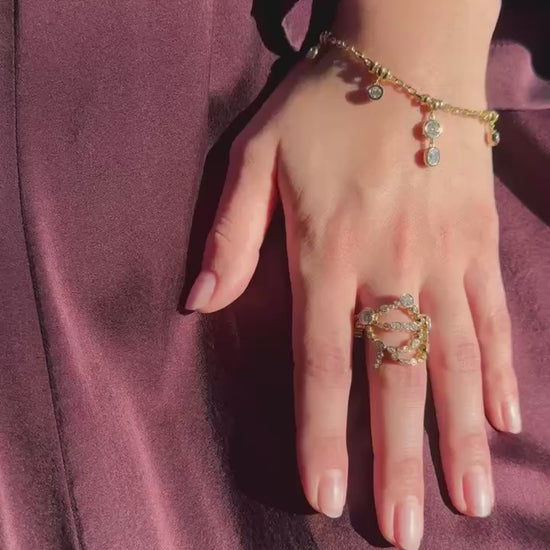 Person wearing Uniform Object fine jewelry 18k yellow gold diamonds Metal Web Ring and Diamond Dust Bracelet