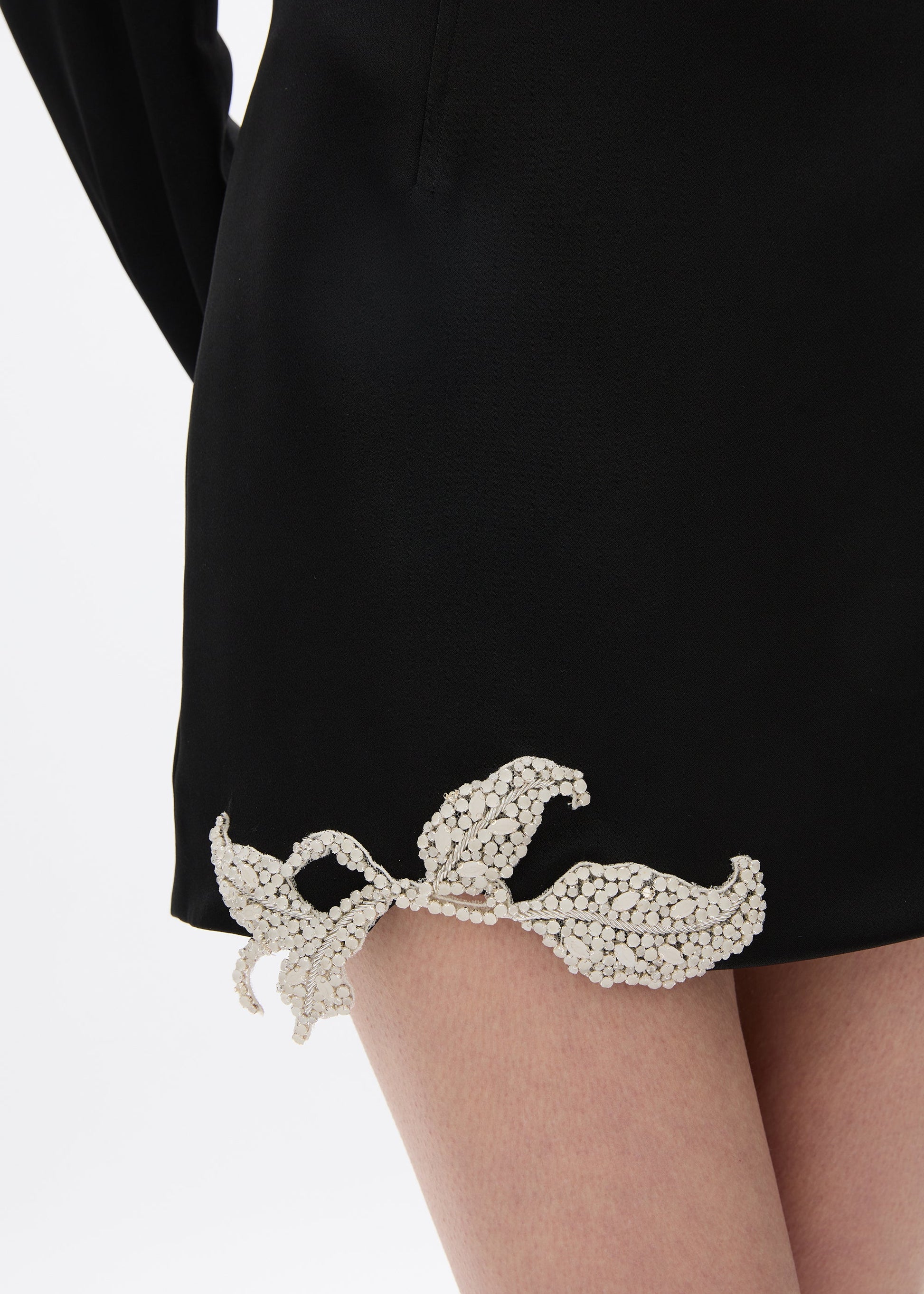 person wearing rachel gilbert satin Hallie Mini Skirt in Black 2