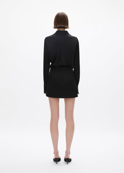 person wearing rachel gilbert satin Hallie Mini Skirt in Black 2