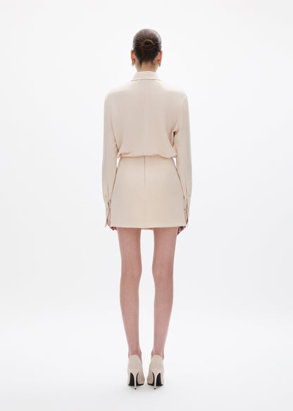 person wearing rachel gilbert satin Hallie Mini Skirt in Champagne