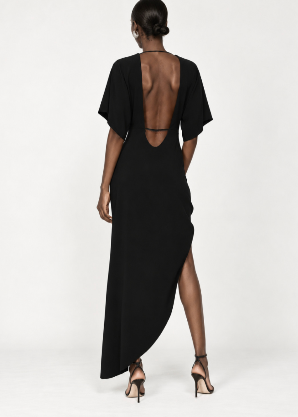 person wearing rev womens The Savita Asymmetric Dress black