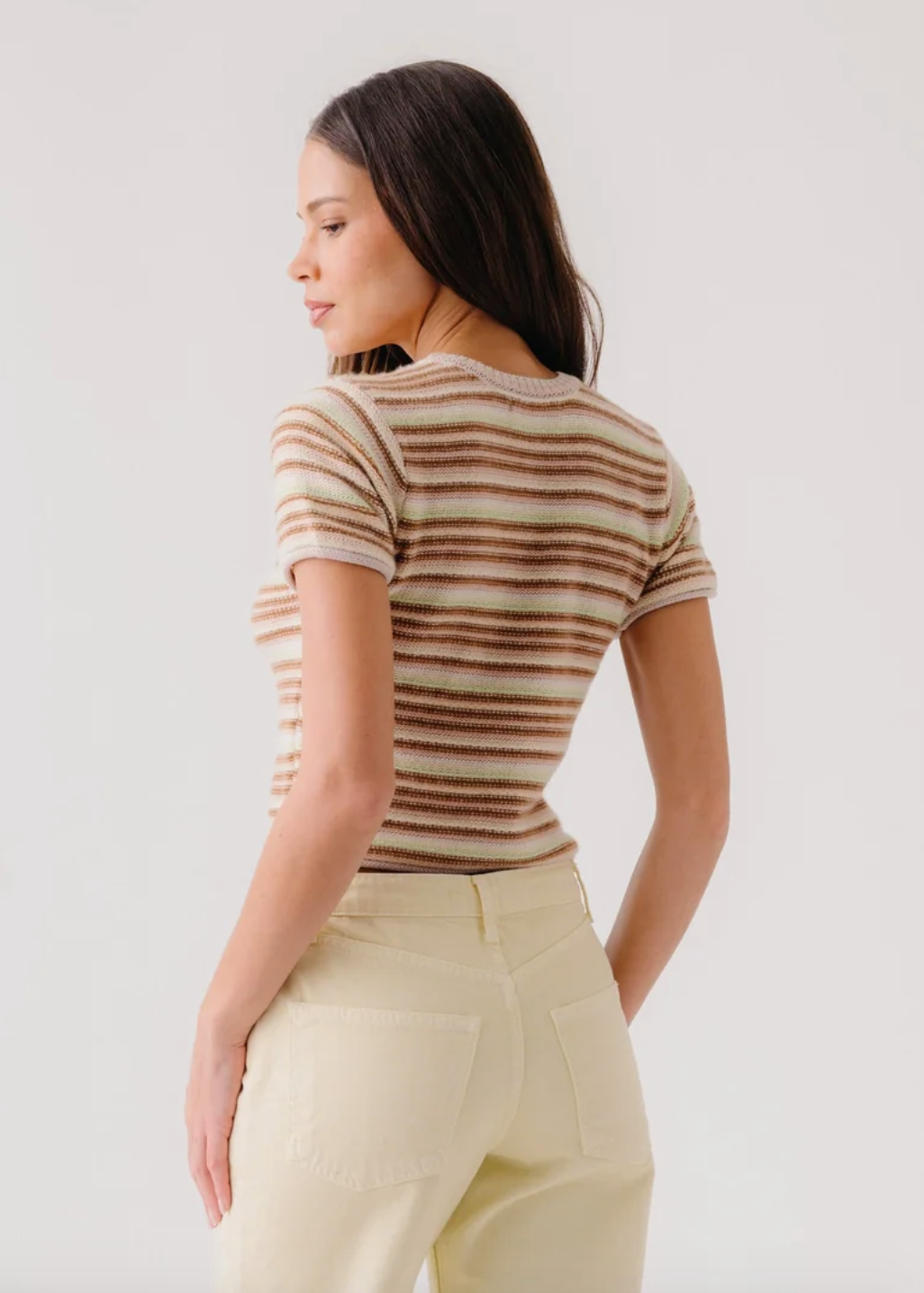 person wearing sablyn Jude Short Sleeve Cashmere Crewneck Tee in Buttercup