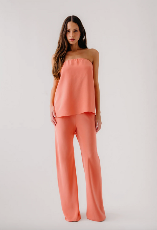 person wearing sablyn womens Camden Silk Strapless Top Naomi Bias Cut Pull on Pant in melon