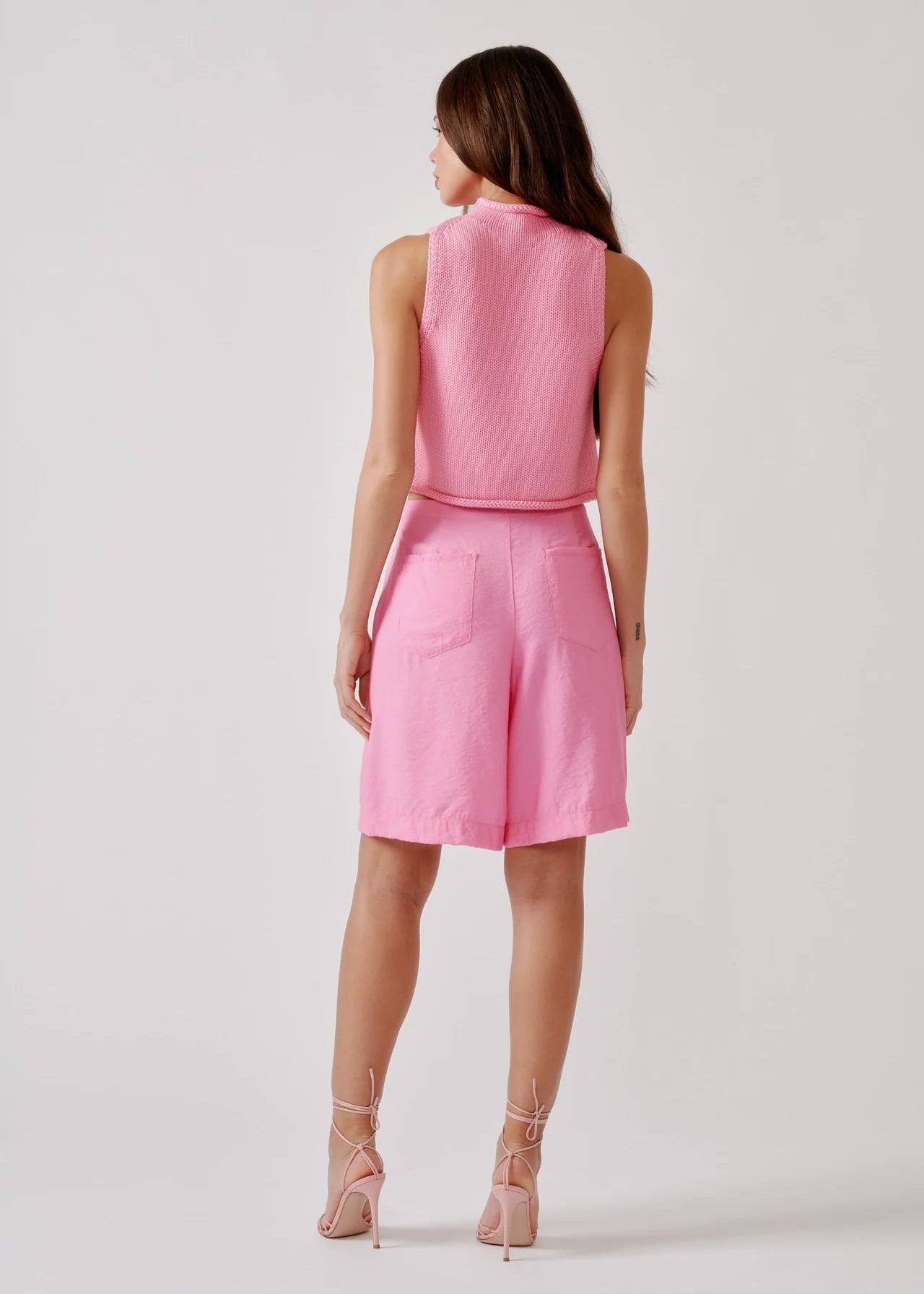 person wearing sablyn womens Giada Roll Neck Tank in Dahlia Pink