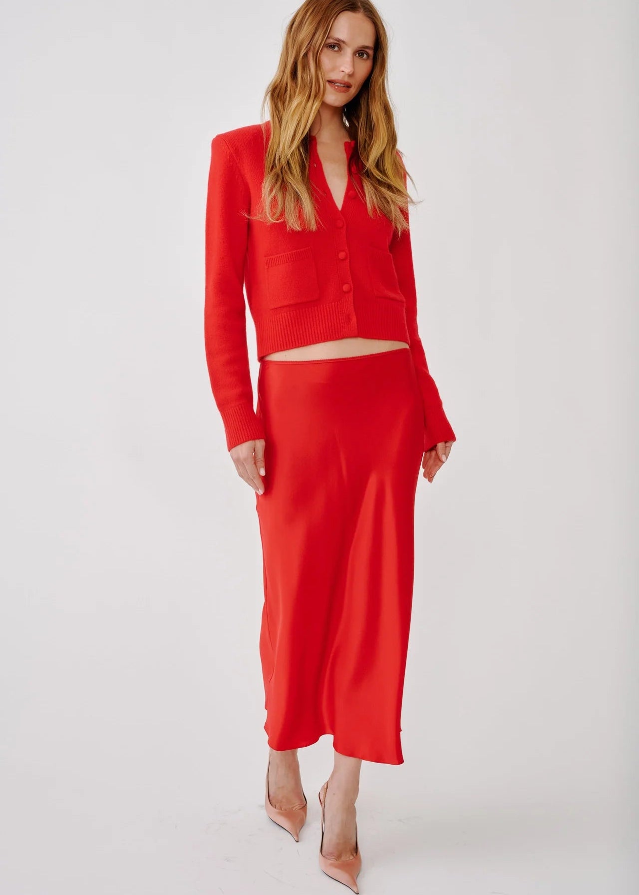 person wearing sablyn womens Miranda B Scallop Trim Bias Cut Skirt in Scarlet red