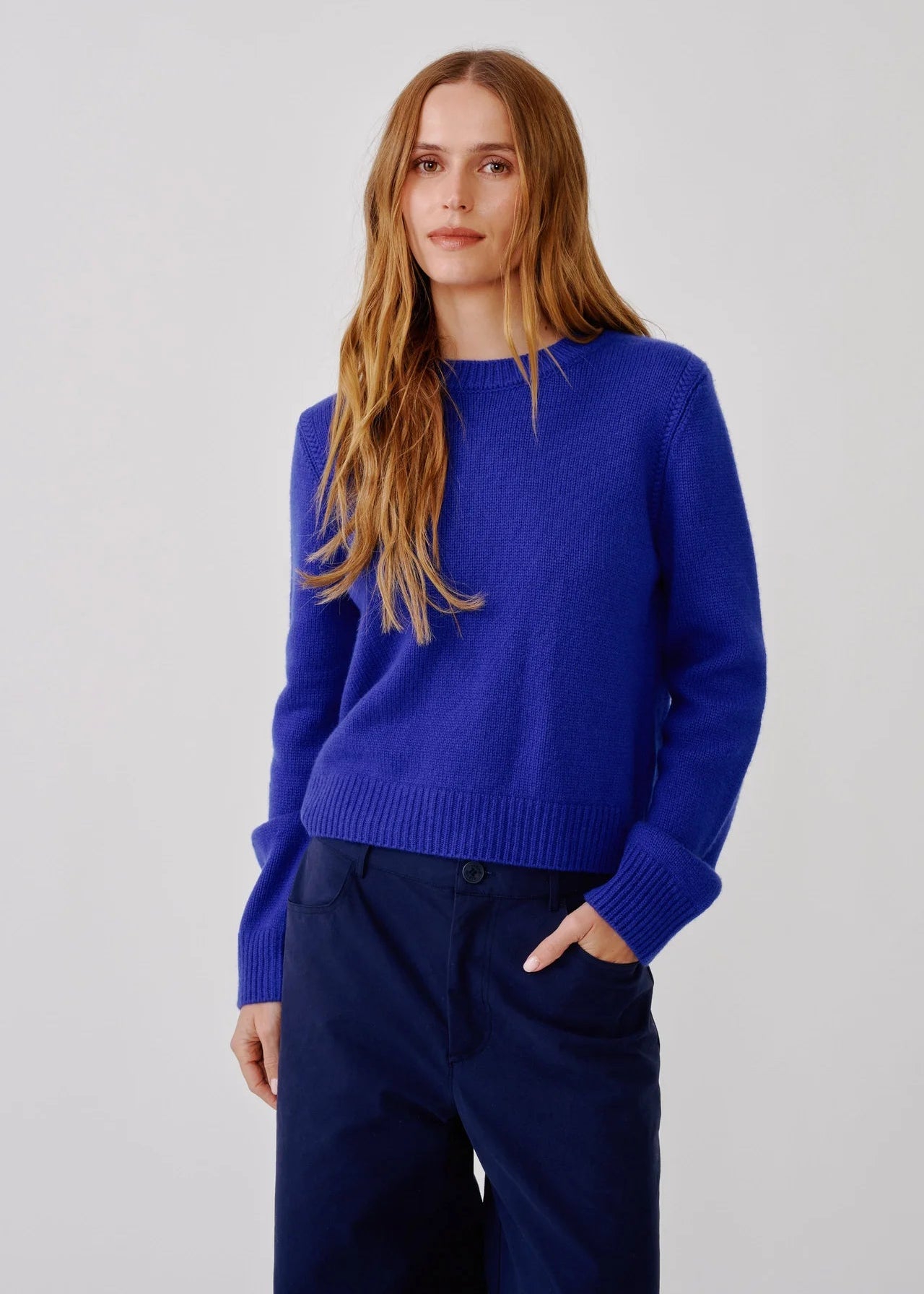 person wearing sablyn womens Noa Shrunken cashmere Crewneck Sweater in Cobalt Blue