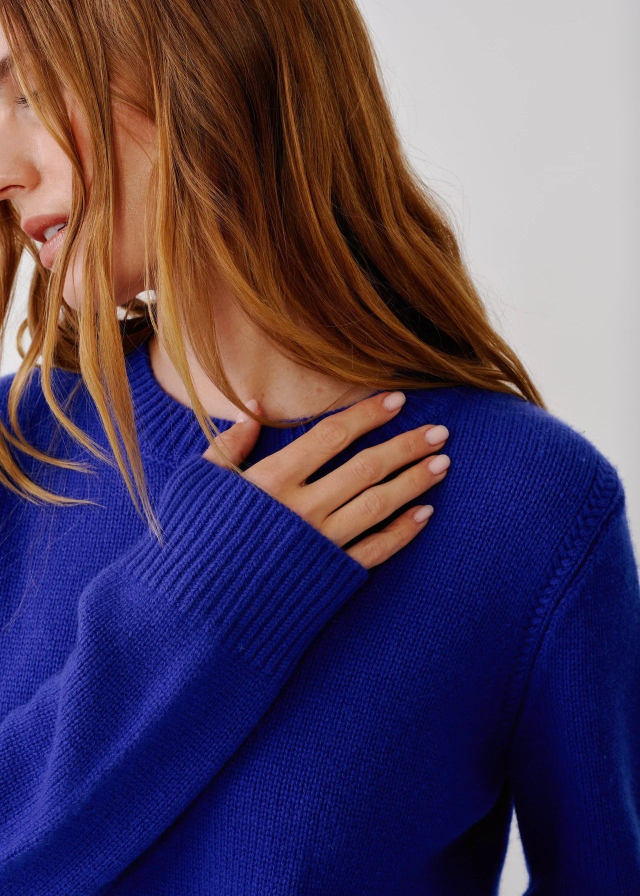 person wearing sablyn womens Noa Shrunken cashmere Crewneck Sweater in Cobalt Blue