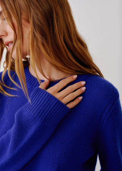 person wearing sablyn womens Noa Shrunken cashmere Crewneck Sweater in Cobalt Blue