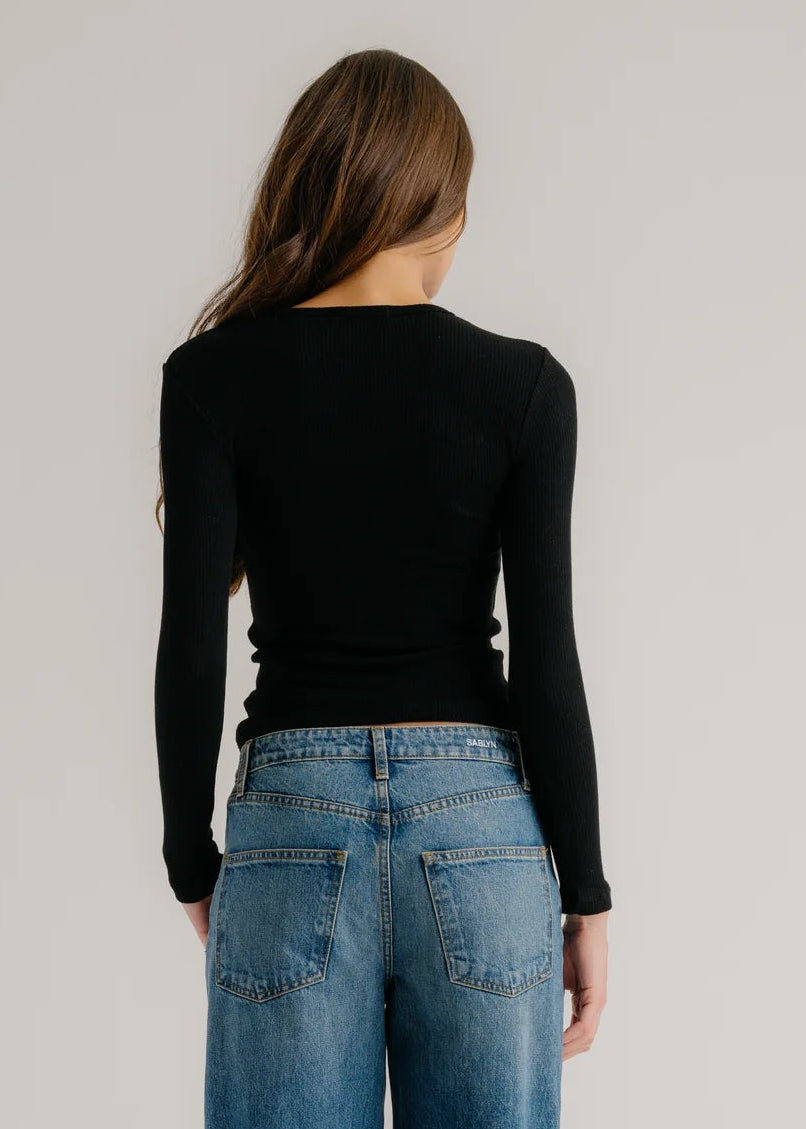person wearing sablyn womens Quincy Long Sleeve Fitted Crewneck Rib Top in Black