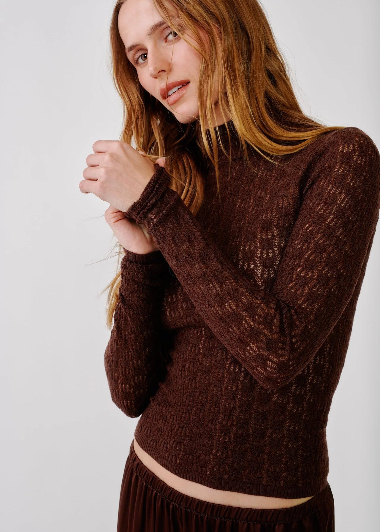 person wearing sablyn womens Rhea Mock Neck Top in Cinnabar brown lightweight wool