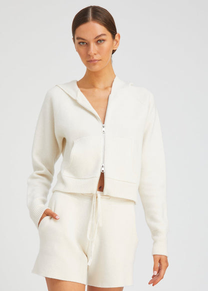 person wearing sablyn womens Shrunken Raglan Cashmere Hoodie in Chalk