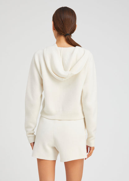 person wearing sablyn womens Shrunken Raglan Cashmere Hoodie in Chalk