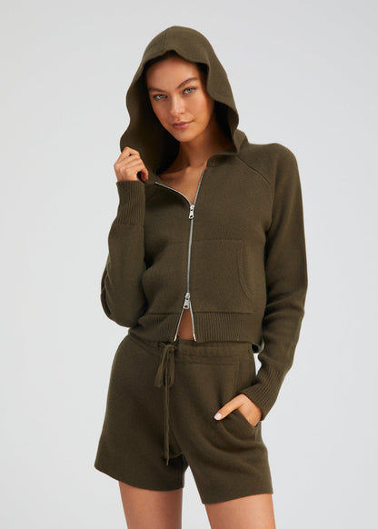 person wearing sablyn womens Shrunken Raglan Cashmere Hoodie in Olive