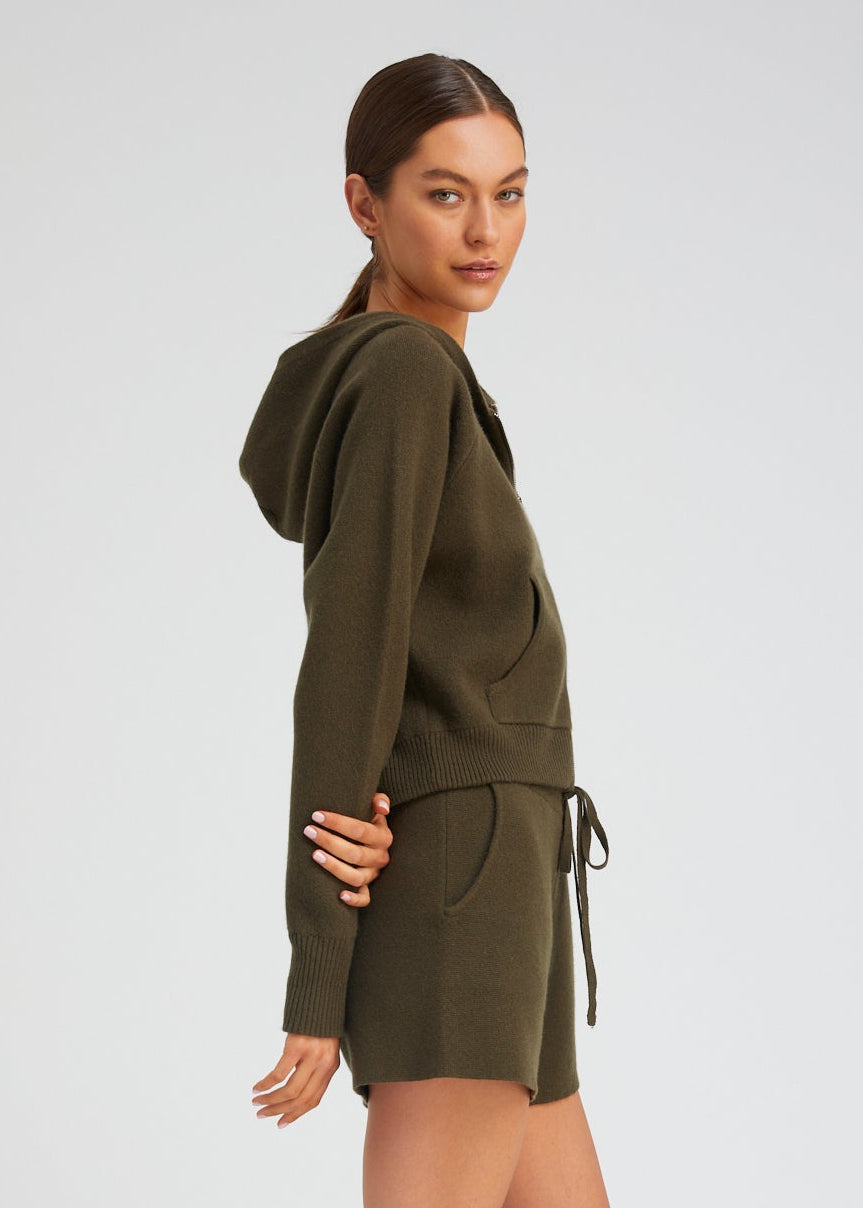 person wearing sablyn womens Shrunken Raglan Cashmere Hoodie in Olive