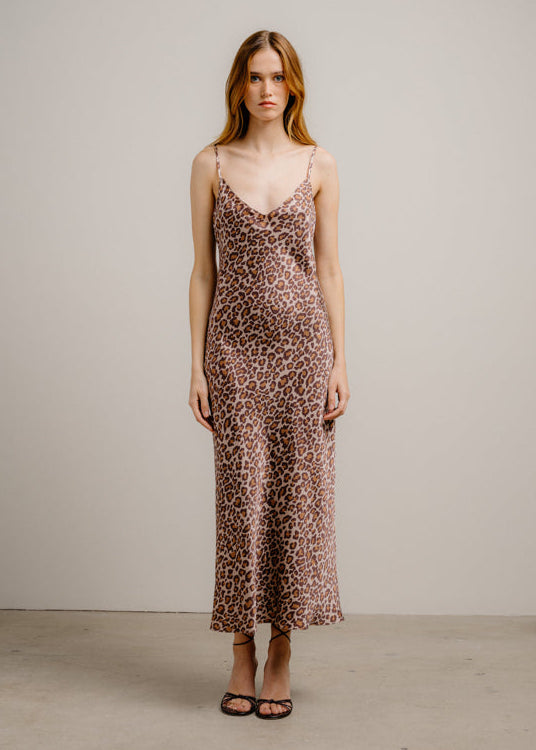 person wearing sablyn womens Taylor D V-Neck Silk Bias Dress in Cinnabar Leopard silk