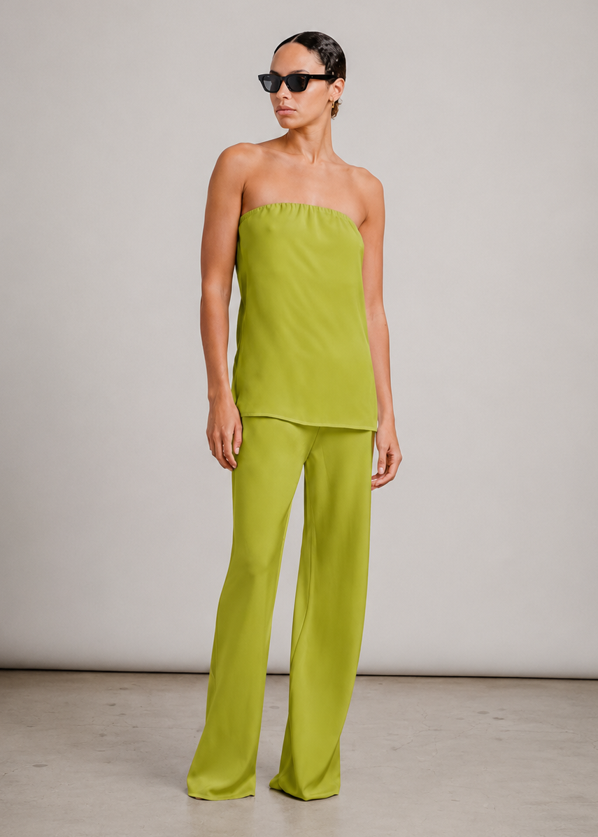 person wearing sablyn womens camden silk top and Naomi Bias Cut Silk Pull on Pants in Chartreuse