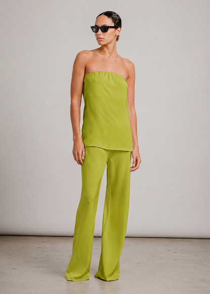 person wearing sablyn womens camden silk top and Naomi Bias Cut Silk Pull on Pants in Chartreuse