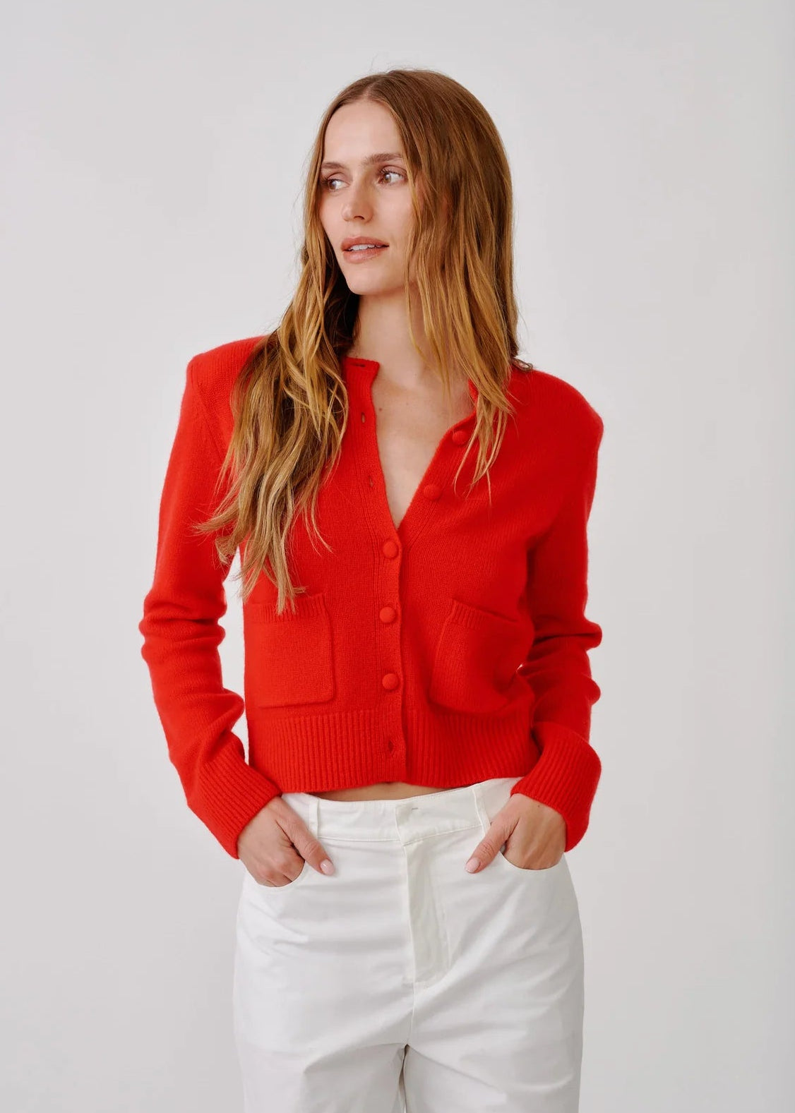 person wearing sablyn womens cashmere Emilia Shoulder Pad Cardigan in Scarlet