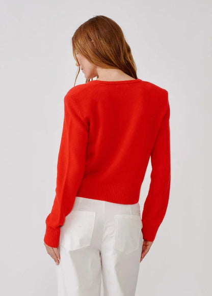 person wearing sablyn womens cashmere Emilia Shoulder Pad Cardigan in Scarlet
