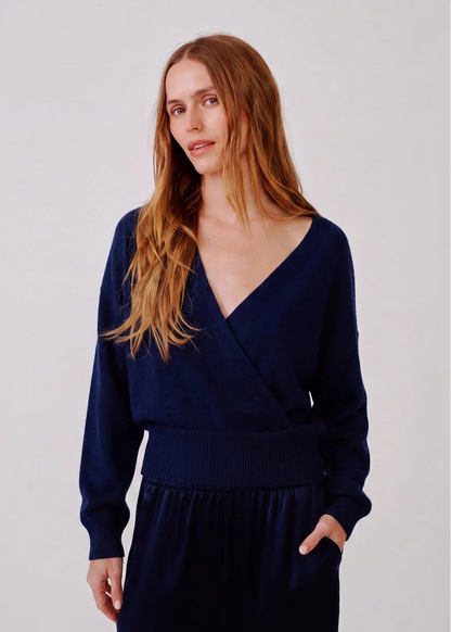 person wearing sablyn womens cashmere Koda Wrap Cashmere Sweater in Midnight Navy