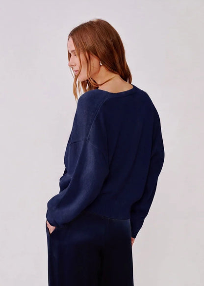 person wearing sablyn womens cashmere Koda Wrap Cashmere Sweater in Midnight Navy