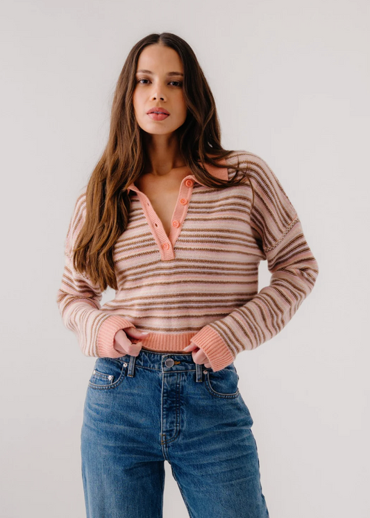 person wearing sablyn womens cashmere Maddie Long Sleeve Cropped Stripe Polo in Melon