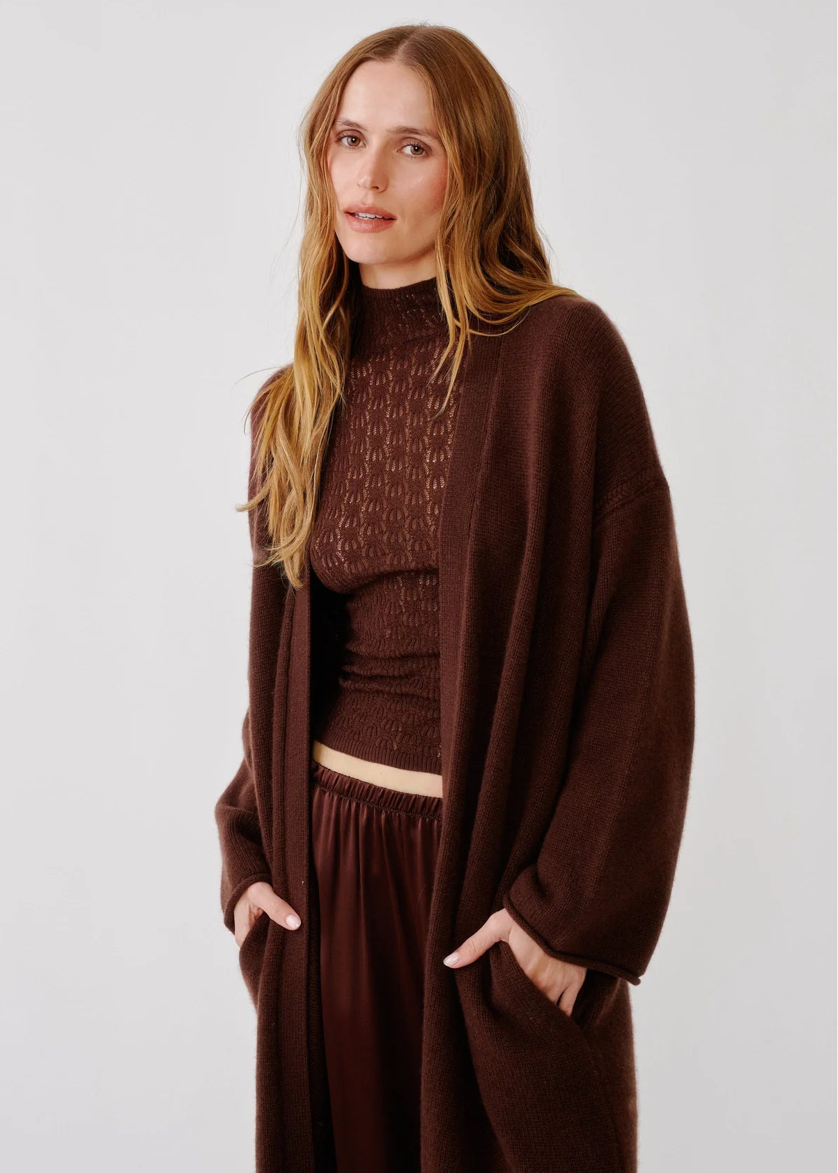 person wearing sablyn womens cashmere Toma Slouchy Cashmere Duster in Cinnabar brown