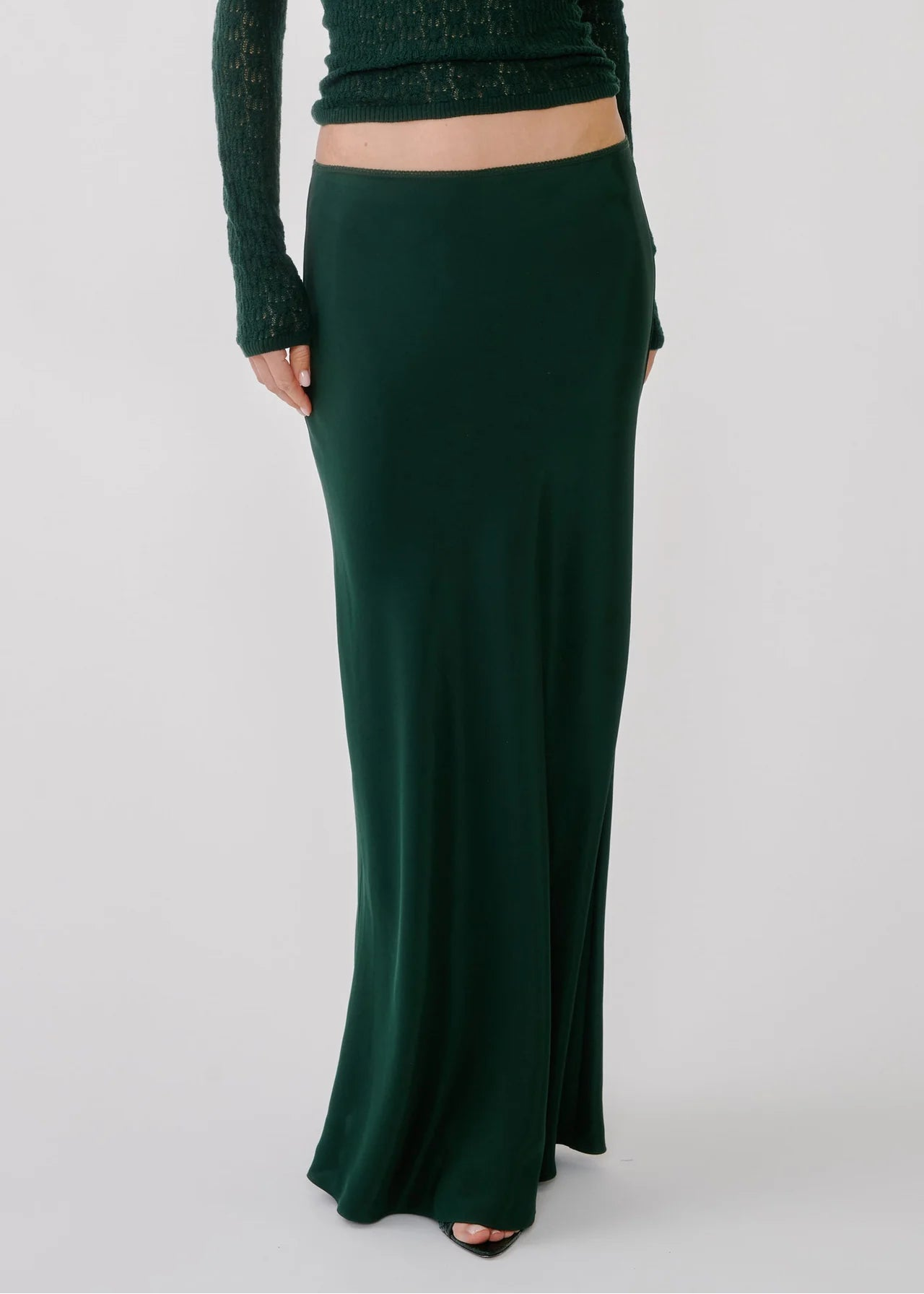 person wearing salbyn womens Grace C Scallop Trim Bias Cut Maxi Skirt in Hunter Green