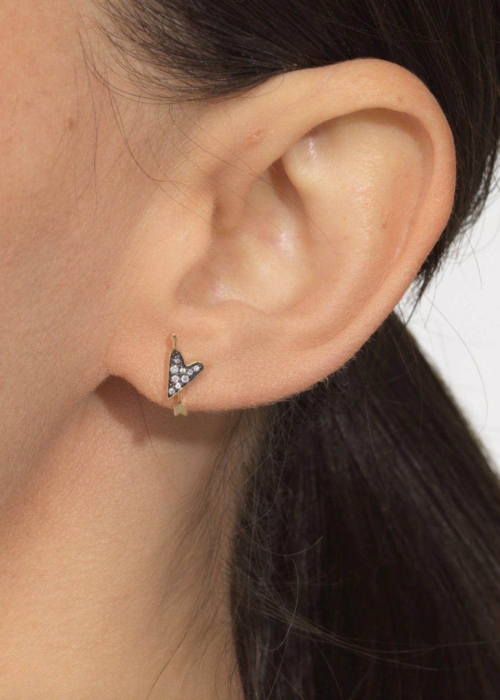person wearing sorellina fine jewelry 18k yellow gold Heart Motif Studs