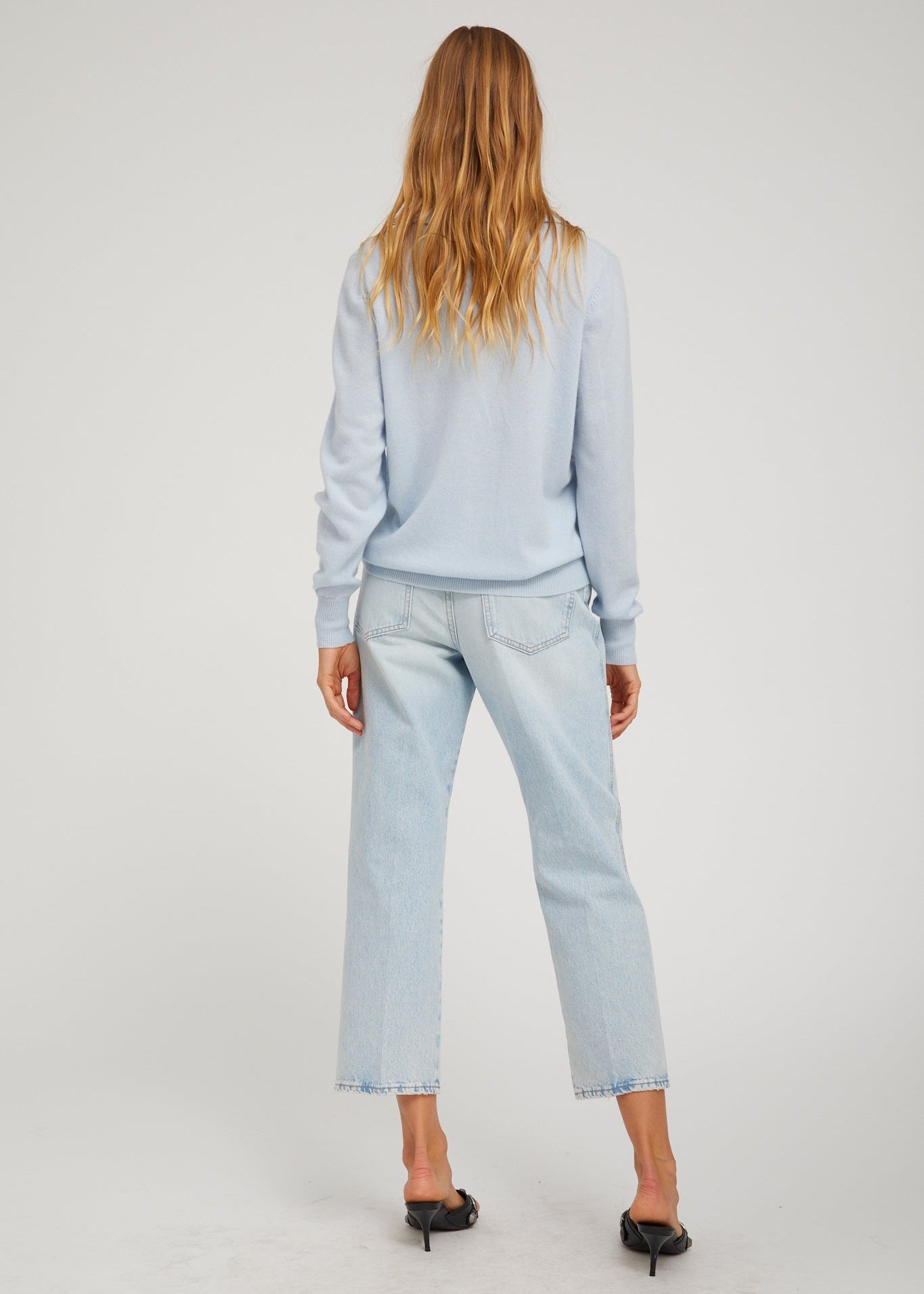 person wearing sprwmn Cashmere Polo Sweater in Baby Blue