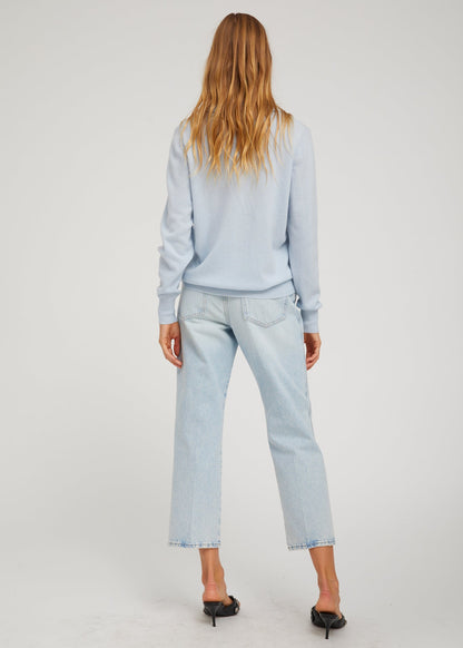 person wearing sprwmn Cashmere Polo Sweater in Baby Blue