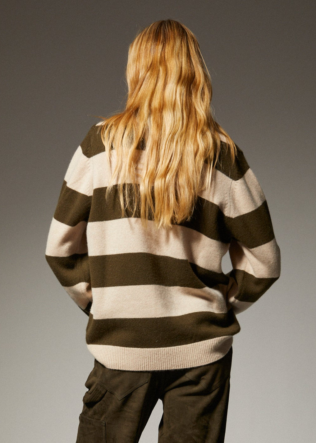person wearing sprwmn Cashmere Polo Sweater in Olive Stripe
