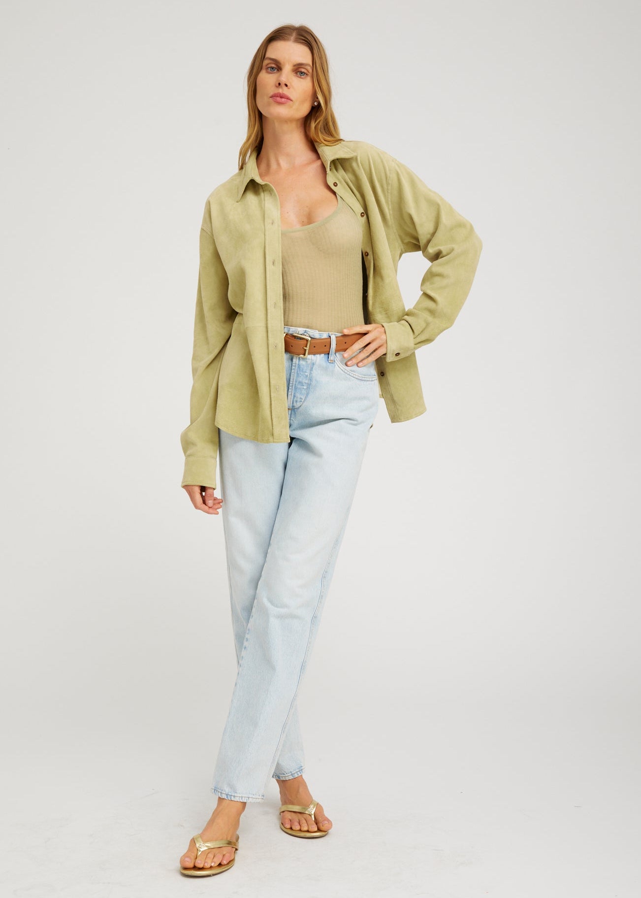 person wearing sprwmn Elise Suede Button Up Shirt in Pistachio
