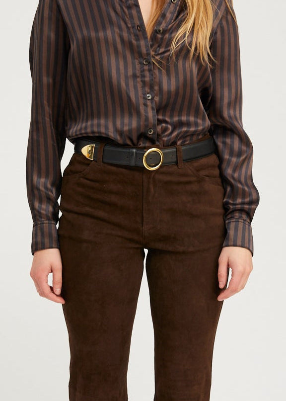 person wearing sprwmn black leather Jackie Belt gold hardware