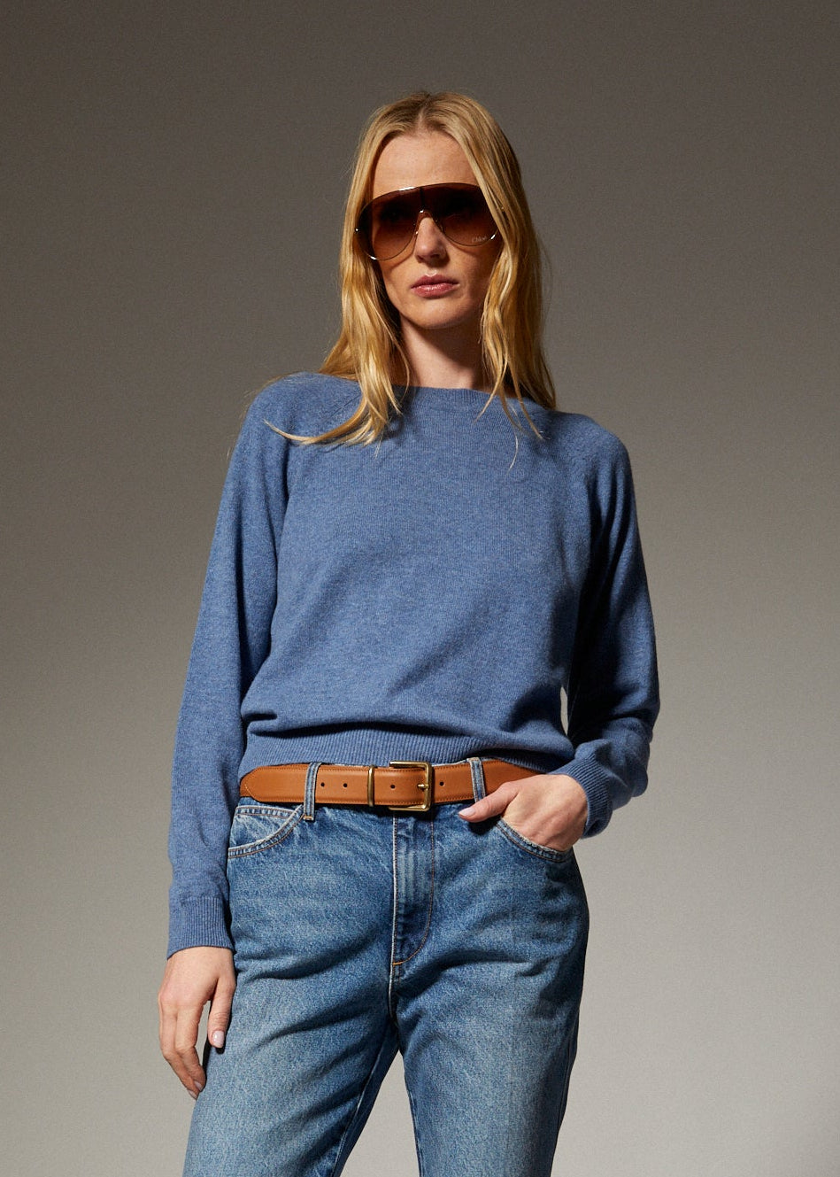 person wearing sprwmn womens Cashmere Raglan Sweater in Chambray Blue