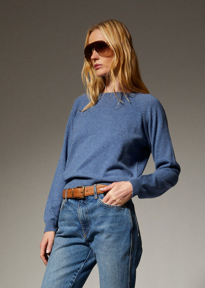 person wearing sprwmn womens Cashmere Raglan Sweater in Chambray Blue