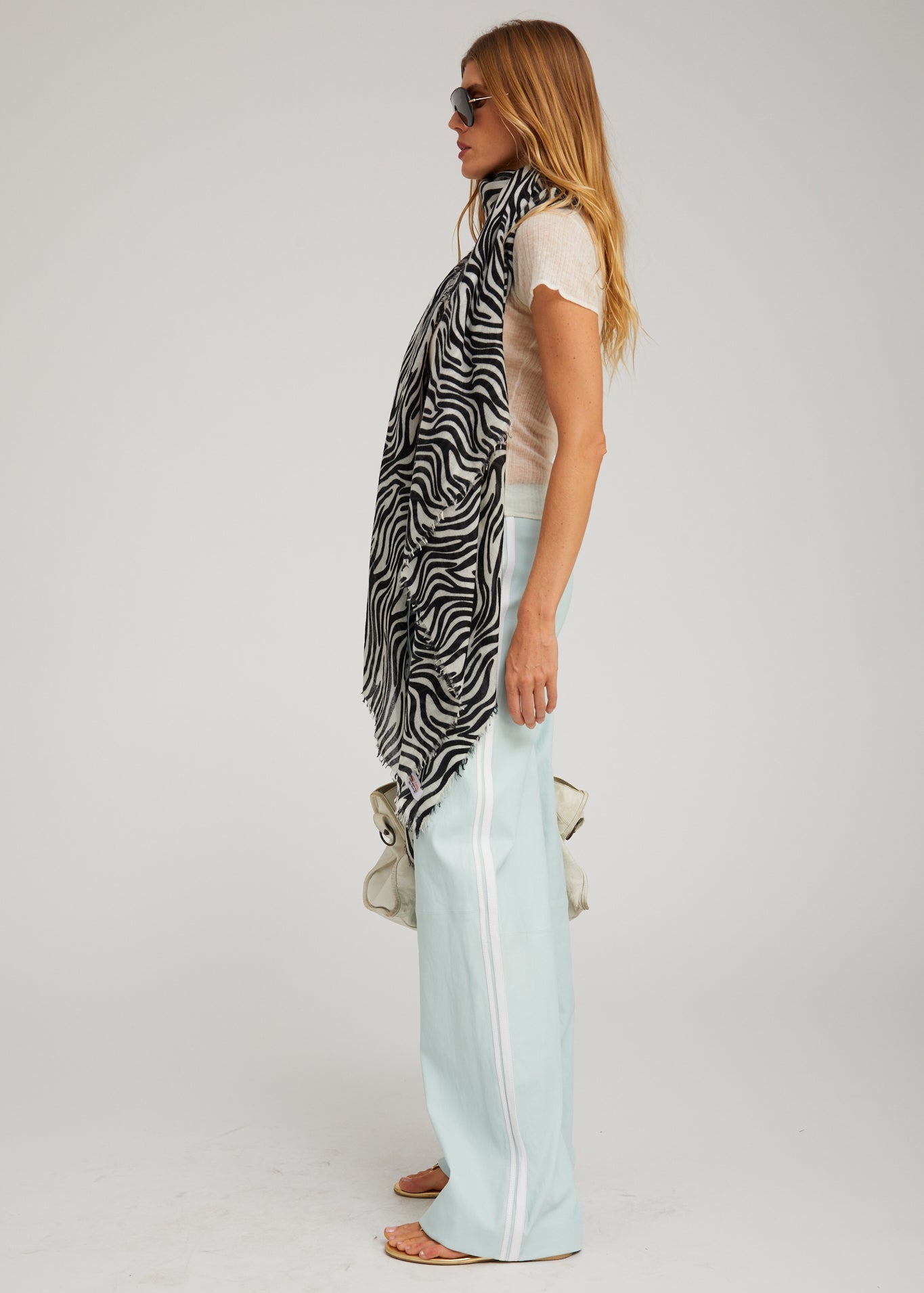 person wearing sprwmn womens Leather Baggy Athletic Pants in Mist white stripe
