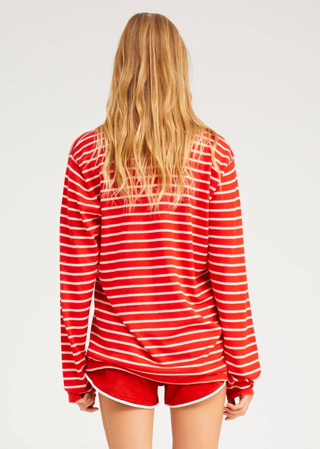 person wearing sprwmn womens Long Sleeve Cashmere Tee red stripes sweater