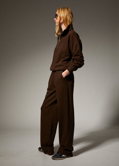 person wearing sprwmn womens Straight Leg Sweatpants quarter zip sweatshirt in Americano