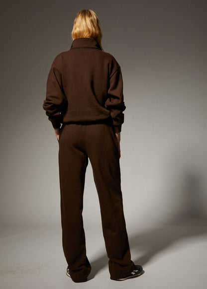 person wearing sprwmn womens Straight Leg Sweatpants quarter zip sweatshirt in Americano