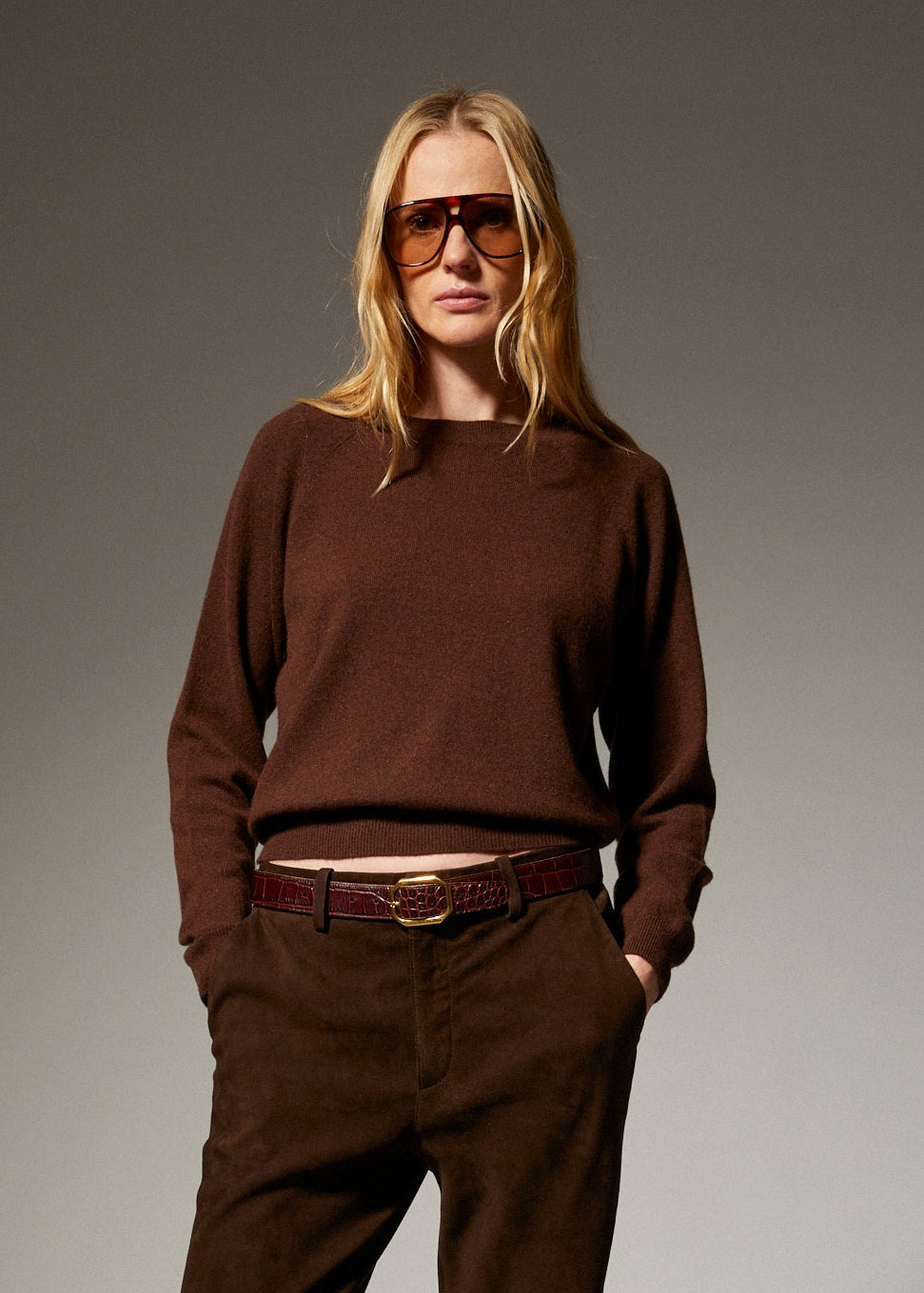 person wearing srpwmn womens Cashmere Raglan Sweater in Americano brown