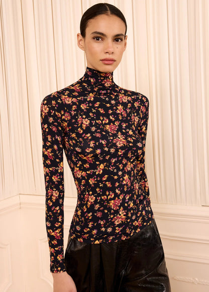 person wearing ulla johnson womens Aurelia Long Sleeve Jersey Top in Noir Floral